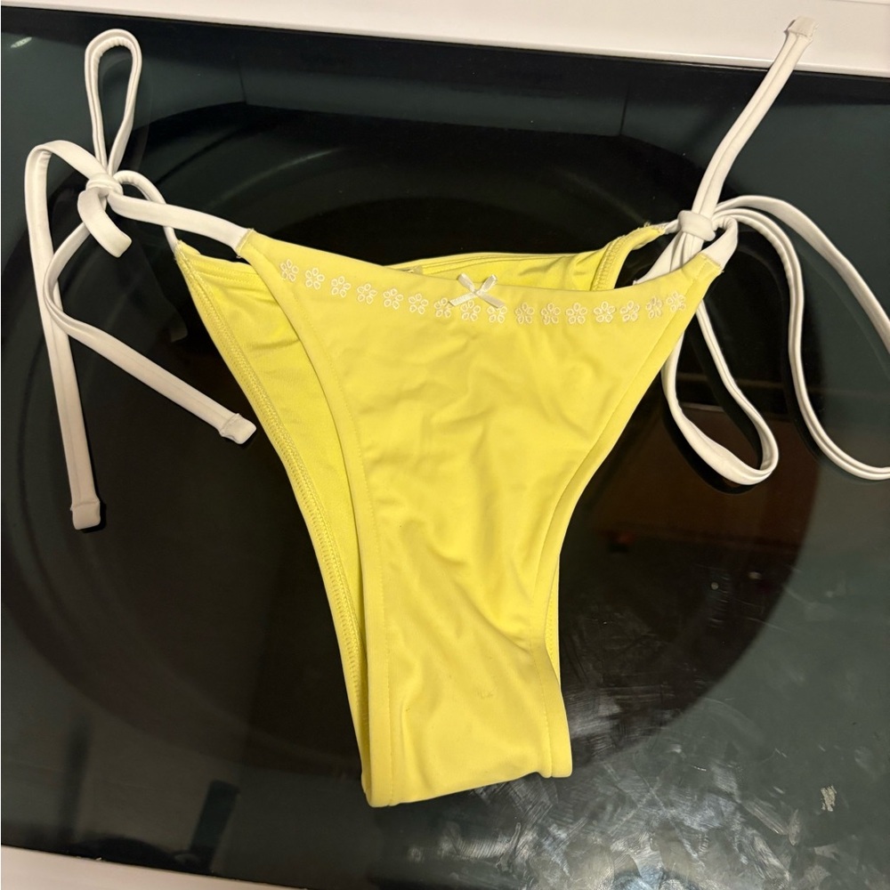 PINK by Frankie’s Bikinis yellow string bottoms